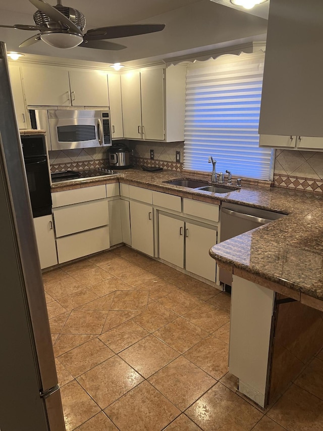 18830 San Quentin Dr, Lathrup Village, MI 48076 - kitchen featuring black appliances, a sink, decorative backsplash, a ceiling fan, and white cabinetry