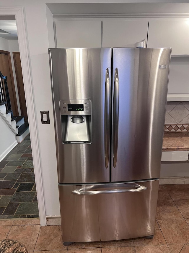 18830 San Quentin Dr, Lathrup Village, MI 48076 - detailed view of stainless steel fridge with ice dispenser and baseboards