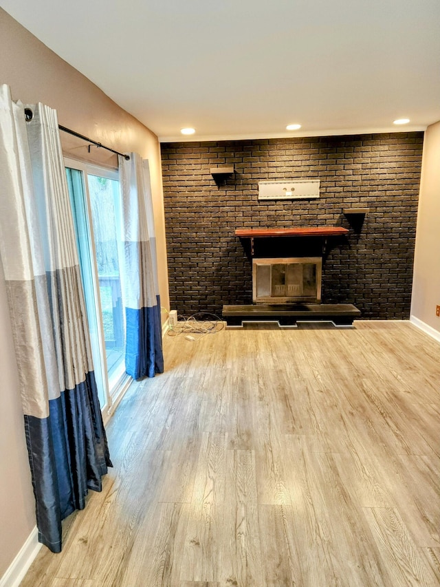 18830 San Quentin Dr, Lathrup Village, MI 48076 - unfurnished living room with wood finished floors, baseboards, and a fireplace