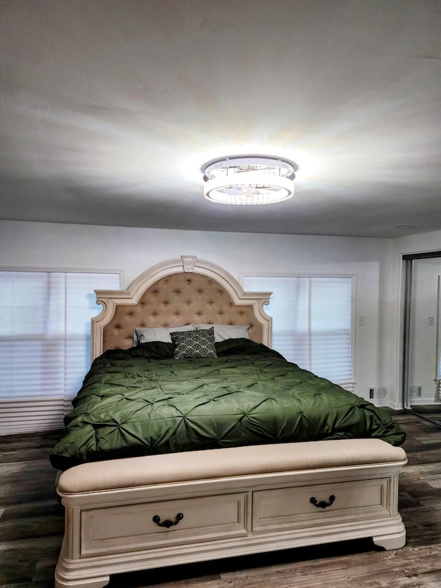 18830 San Quentin Dr, Lathrup Village, MI 48076 - bedroom featuring dark wood-style floors and multiple windows
