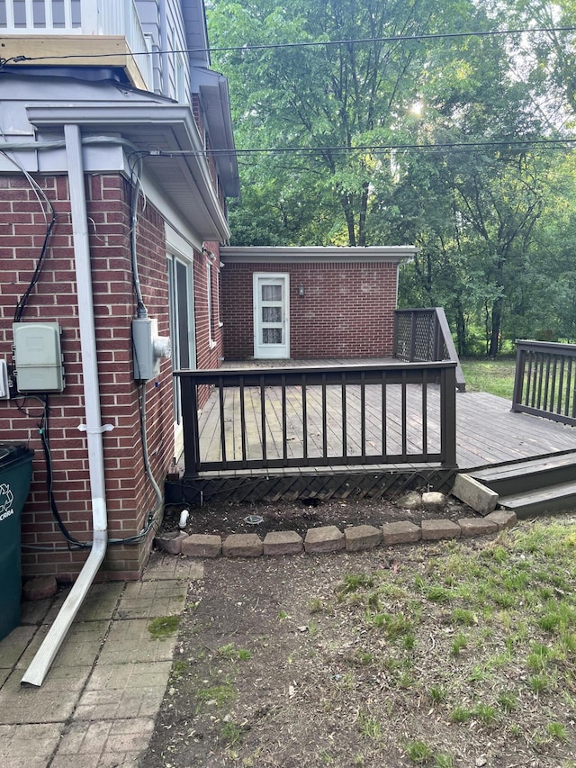 18830 San Quentin Dr, Lathrup Village, MI 48076 - view of home's exterior featuring brick siding and a wooden deck