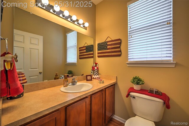28329 Cottage Ln, New Hudson, MI 48165 - bathroom featuring vanity and toilet