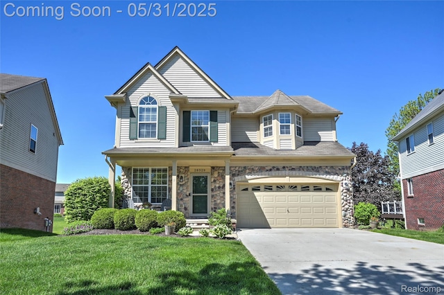 28329 Cottage Ln, New Hudson, MI 48165 - traditional home with an attached garage, concrete driveway, a front lawn, and stone siding