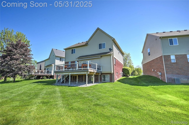 28329 Cottage Ln, New Hudson, MI 48165 - rear view of property featuring a wooden deck, a yard, central AC, and brick siding