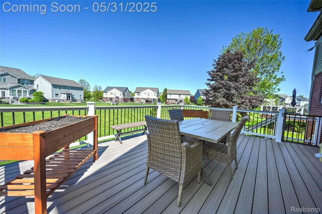 28329 Cottage Ln, New Hudson, MI 48165 - wooden deck with a residential view, a yard, and outdoor dining space