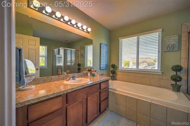 28329 Cottage Ln, New Hudson, MI 48165 - full bath featuring a stall shower, a garden tub, vanity, and tile patterned flooring