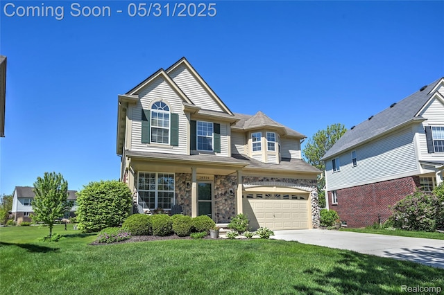 28329 Cottage Ln, New Hudson, MI 48165 - view of front of home featuring a garage, concrete driveway, a front lawn, and stone siding