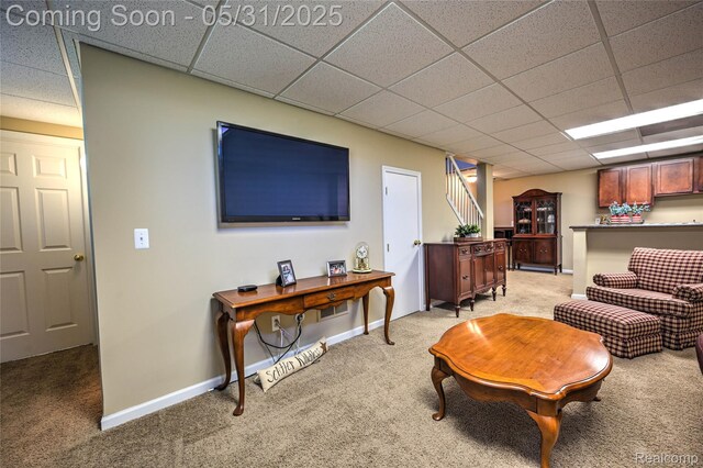 28329 Cottage Ln, New Hudson, MI 48165 - living room featuring light colored carpet, a paneled ceiling, and baseboards