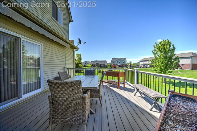 28329 Cottage Ln, New Hudson, MI 48165 - wooden deck featuring outdoor dining area, a residential view, and a yard