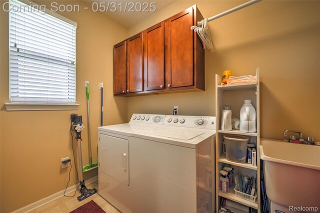 28329 Cottage Ln, New Hudson, MI 48165 - laundry room featuring washing machine and clothes dryer, cabinet space, and light tile patterned floors