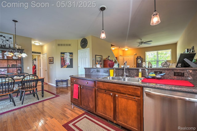 28329 Cottage Ln, New Hudson, MI 48165 - kitchen featuring stainless steel dishwasher, a sink, hardwood / wood-style floors, a ceiling fan, and dark countertops