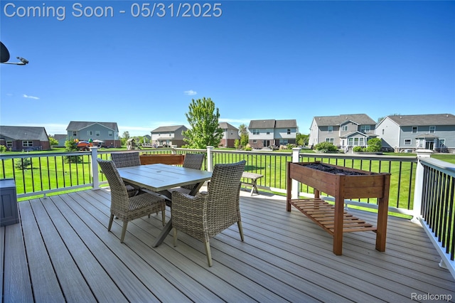 28329 Cottage Ln, New Hudson, MI 48165 - deck with a residential view, outdoor dining area, and a lawn