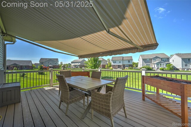 28329 Cottage Ln, New Hudson, MI 48165 - deck featuring a residential view, outdoor dining space, and a lawn