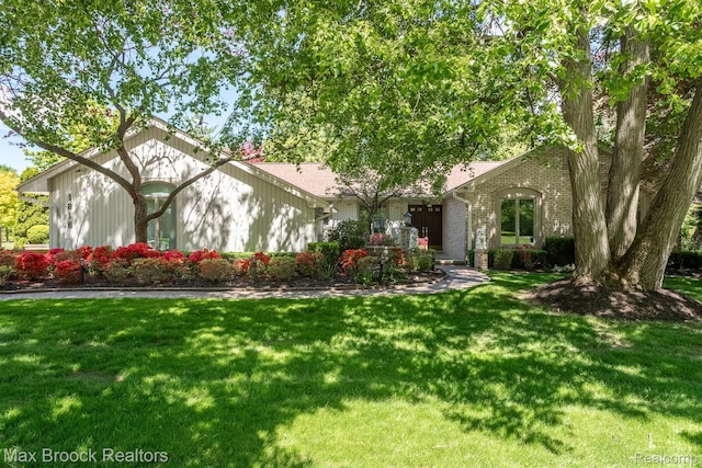 1816 Ledbury Dr, Bloomfield Hills, MI 48304 - view of front of home with a front yard and brick siding