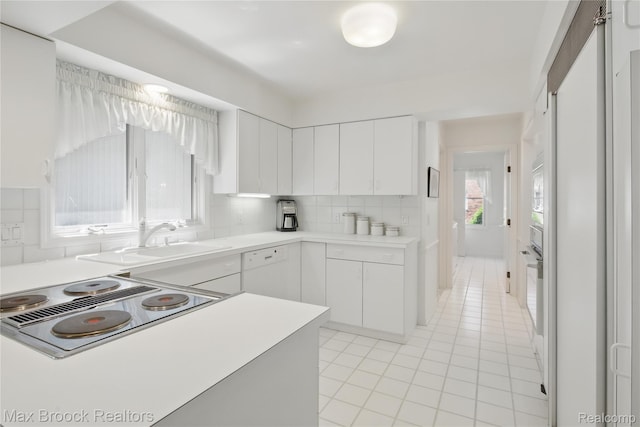 1816 Ledbury Dr, Bloomfield Hills, MI 48304 - kitchen with a sink, tasteful backsplash, light countertops, light tile patterned flooring, and white cabinets