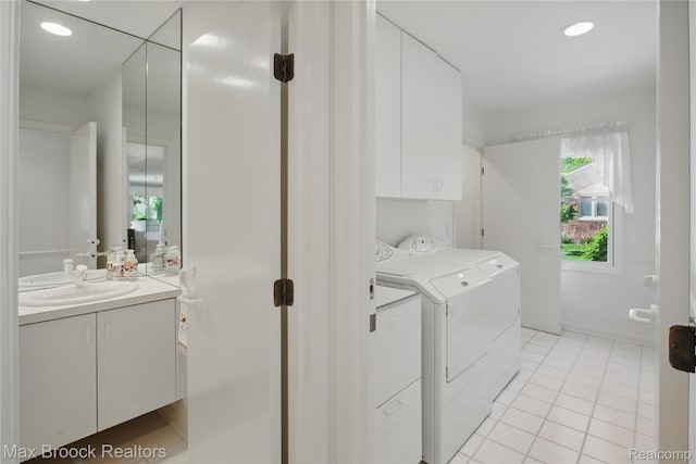 1816 Ledbury Dr, Bloomfield Hills, MI 48304 - laundry area featuring washer and dryer, light tile patterned flooring, cabinet space, and recessed lighting