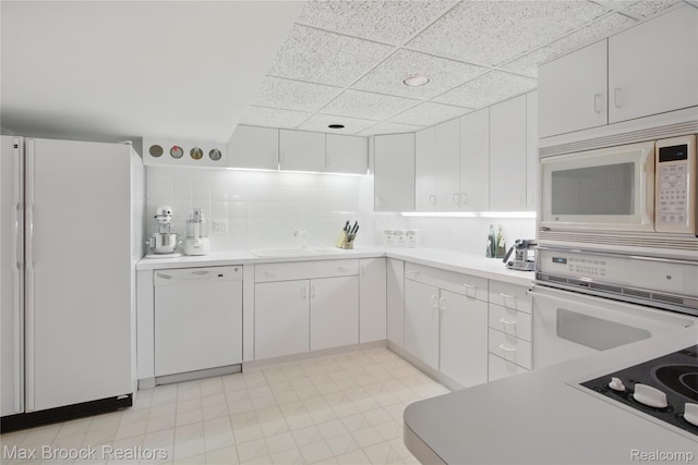1816 Ledbury Dr, Bloomfield Hills, MI 48304 - kitchen with white appliances, a paneled ceiling, light countertops, white cabinets, and light flooring