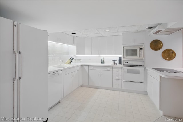 1816 Ledbury Dr, Bloomfield Hills, MI 48304 - kitchen with white appliances, light countertops, a sink, white cabinets, and tasteful backsplash