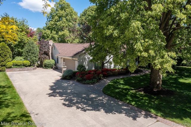 1816 Ledbury Dr, Bloomfield Hills, MI 48304 - view of front of house with concrete driveway, a chimney, and a front lawn