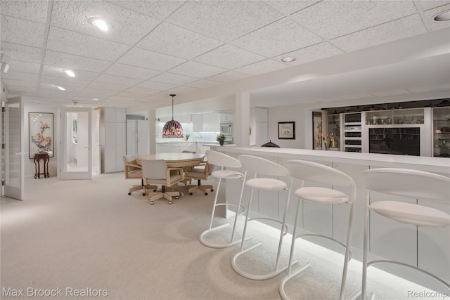 1816 Ledbury Dr, Bloomfield Hills, MI 48304 - bar featuring a drop ceiling, white microwave, and carpet