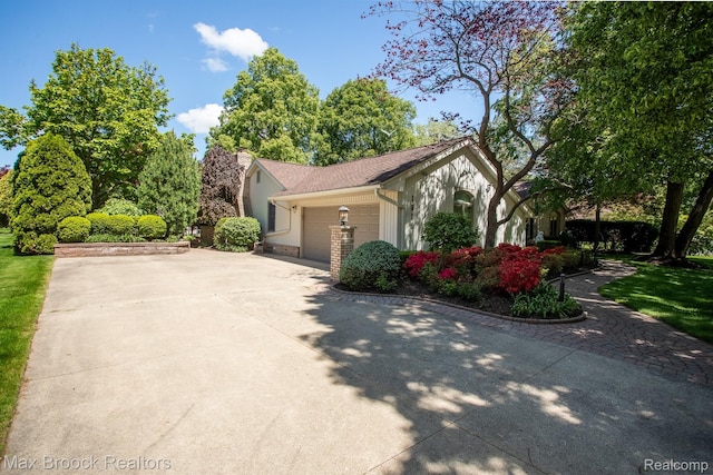 1816 Ledbury Dr, Bloomfield Hills, MI 48304 - view of side of home featuring driveway and an attached garage