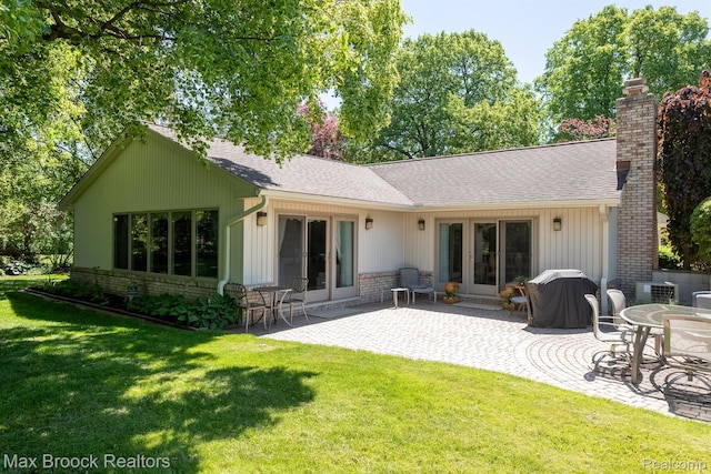 1816 Ledbury Dr, Bloomfield Hills, MI 48304 - rear view of property with a chimney, a shingled roof, a patio area, a yard, and brick siding