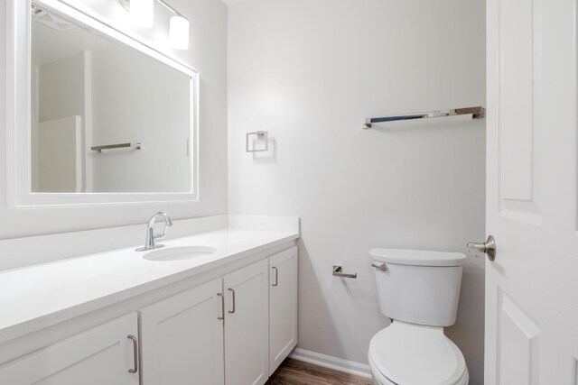 157 Hunters Ln NE, Rockford, MI 49341 - bathroom with vanity, baseboards, and toilet