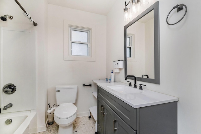 723 Baxter St SE, Grand Rapids, MI 49503 - full bath featuring vanity, baseboards, toilet, and shower / washtub combination