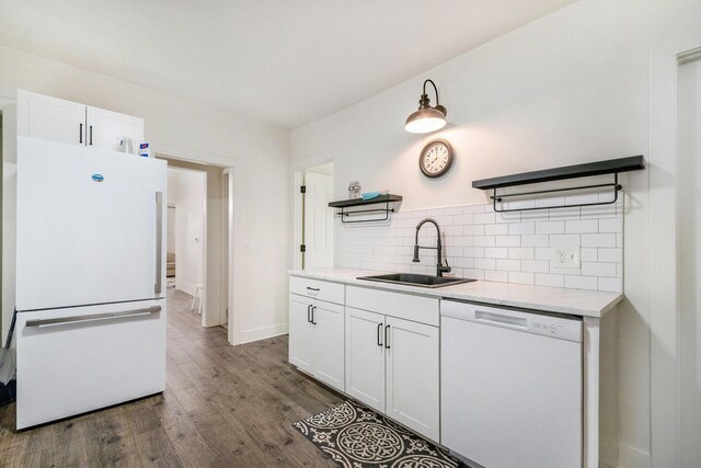 723 Baxter St SE, Grand Rapids, MI 49503 - kitchen with white appliances, a sink, open shelves, white cabinetry, and tasteful backsplash