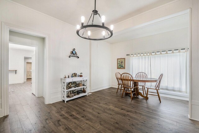 723 Baxter St SE, Grand Rapids, MI 49503 - dining space featuring a chandelier, dark wood-style flooring, and crown molding