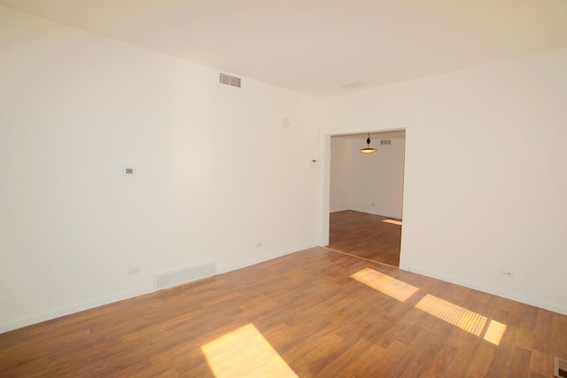 428 Catherine Ave, Muskegon, MI 49442 - empty room with wood finished floors and baseboards