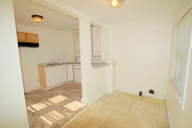 428 Catherine Ave, Muskegon, MI 49442 - laundry room featuring a sink and baseboards