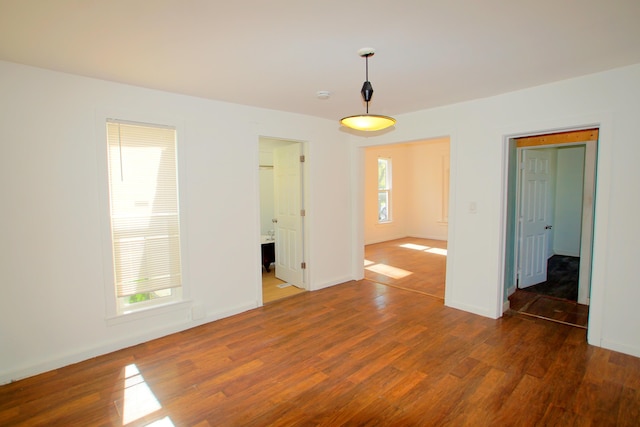 428 Catherine Ave, Muskegon, MI 49442 - spare room featuring wood finished floors and baseboards