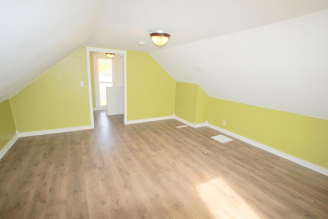 428 Catherine Ave, Muskegon, MI 49442 - additional living space featuring light wood-type flooring, vaulted ceiling, and baseboards