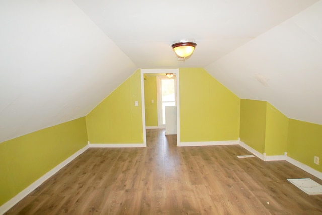 428 Catherine Ave, Muskegon, MI 49442 - additional living space with wood finished floors, baseboards, and lofted ceiling