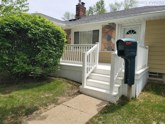 29751 Balmoral St, Garden City, MI 48135 - doorway to property featuring a chimney, a shingled roof, and stone siding
