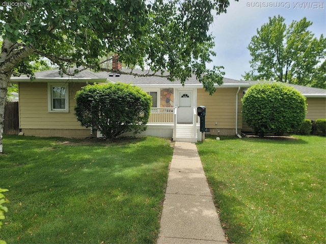 29751 Balmoral St, Garden City, MI 48135 - view of front of property featuring a front yard, a chimney, and roof with shingles