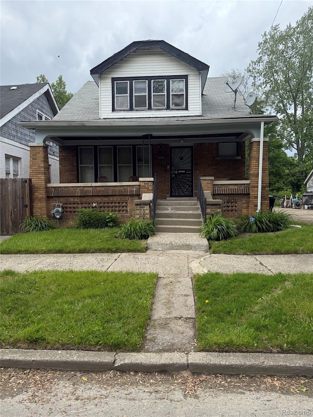 8071 Elgin St, Detroit, MI 48234 - bungalow featuring a porch and brick siding