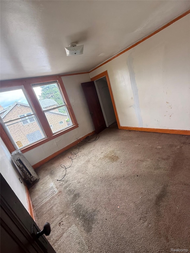 8071 Elgin St, Detroit, MI 48234 - carpeted spare room with crown molding and baseboards