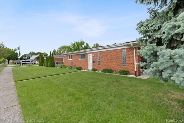 11498 Racine Rd, Warren, MI 48093 - view of front of home featuring brick siding and a front lawn