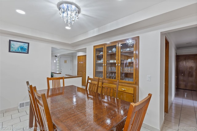 11498 Racine Rd, Warren, MI 48093 - dining area featuring light tile patterned flooring, baseboards, recessed lighting, and a chandelier