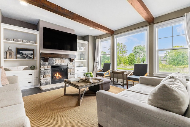 1506 Providence Cove Ct, Byron Center, MI 49315 - living area featuring a fireplace, beamed ceiling, plenty of natural light, and wood finished floors