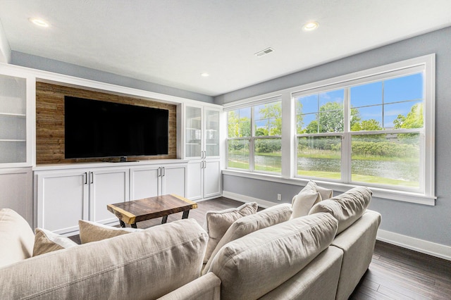 1506 Providence Cove Ct, Byron Center, MI 49315 - living area featuring baseboards, dark wood-type flooring, recessed lighting, and built in shelves
