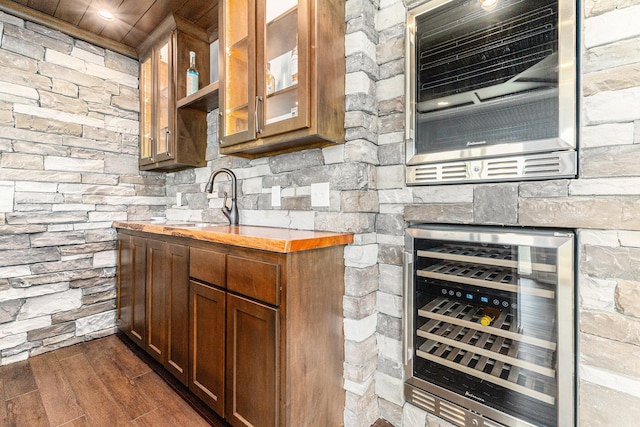 1506 Providence Cove Ct, Byron Center, MI 49315 - kitchen featuring beverage cooler, dark wood-style flooring, glass insert cabinets, light countertops, and a sink