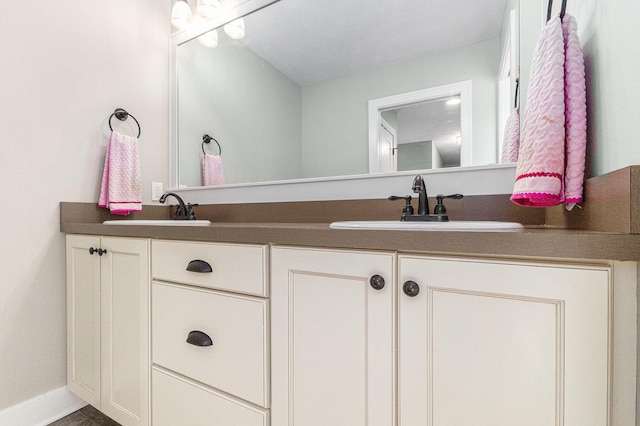 1506 Providence Cove Ct, Byron Center, MI 49315 - bathroom featuring double vanity and baseboards