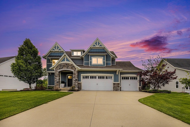 1506 Providence Cove Ct, Byron Center, MI 49315 - view of front of home featuring stone siding, concrete driveway, board and batten siding, and a front yard
