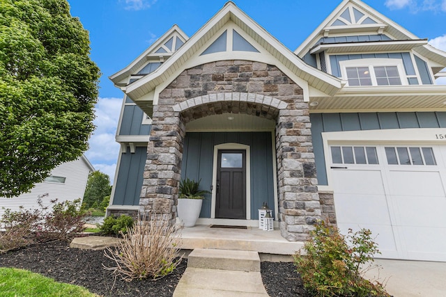 1506 Providence Cove Ct, Byron Center, MI 49315 - property entrance with board and batten siding, stone siding, and a garage