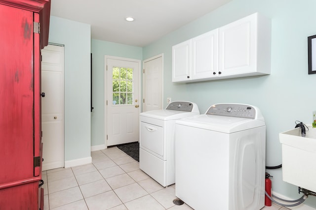 647 S Spinningwheel Ln, Michigan, MI 48304 - washroom with cabinet space, washer and clothes dryer, light tile patterned floors, and recessed lighting