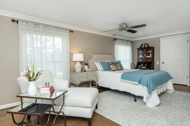 647 S Spinningwheel Ln, Michigan, MI 48304 - bedroom with ornamental molding, wood finished floors, a ceiling fan, and baseboards