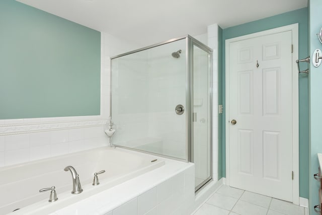 647 S Spinningwheel Ln, Michigan, MI 48304 - bathroom with a bath, a stall shower, and tile patterned flooring